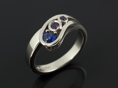 Ladies Sapphire and Amethyst Dress Ring, Palladium Rub over and Claw Set Contemporary Twist Design, Round Brilliant Sapphire and Round Brilliant Amethysts x2