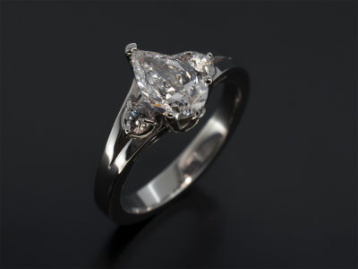 Ladies Trilogy Diamond Engagement Ring, Platinum Claw Set Celtic Inspired Design, Pear Cut Diamond Centre Stone 0.70ct, D Colour, SI2 Clarity, EXVG, Round Brilliant Cut Diamond Sides 0.24ct (Total), Split Shoulder Detail
