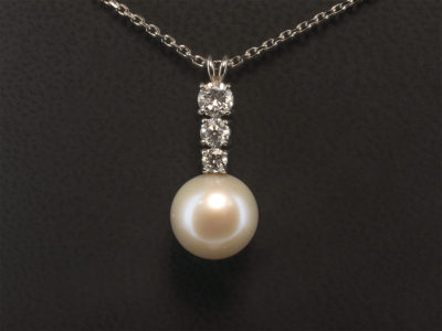 Platinum Claw Set Diamond and Pearl Drop Pendant, Round 10mm Mid Ivory Colour Freshwater Pearl and Round Brilliant Cut Diamonds 0.67ct Total F Colour VS Clarity Minimum