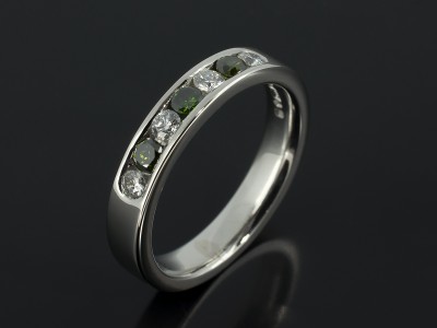 Platinum Green and White Diamond Channel Set Eternity Ring.