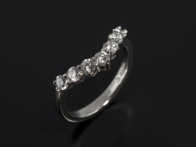 Platinum Fitted Shared Claw Set Wedding Ring with 0.93ct Round Brilliant Cut Diamonds.