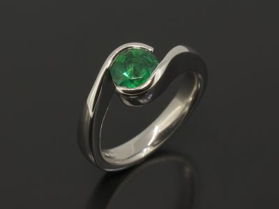 Round Brilliant Cut Emerald, 0.94ct Part Tension Set in Platinum in a Twist Design