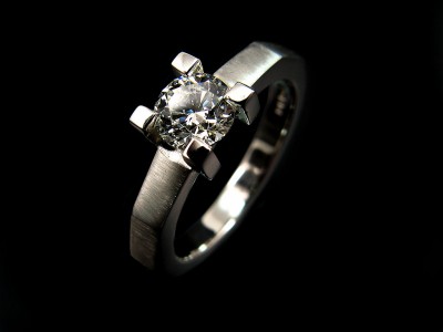 Platinum 4 claw, Edged Band Engagement Ring with a 0.60ct F colour SI1 clarity Excellent Cut Grade Round Brilliant Diamond