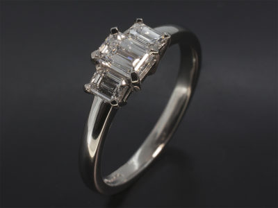 Ladies Trilogy Diamond Engagement Ring, Platinum Claw Set Design, Emerald Cut Diamond Centre Stone 0.41ct, VS2 Clarity, Emerald Cut Diamond Side Stones 0.27ct Total