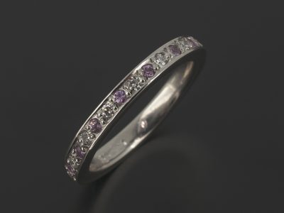 Platinum Wedding / Eternity Ring with Round Brilliant Pavé Set Diamonds and Pink Sapphies.