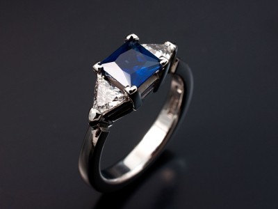 Palladium Trilogy Setting with Princess Cut Sapphire 0.84ct. Trilliant Cut Diamonds 0.38ct G Colour VS Clarity Min