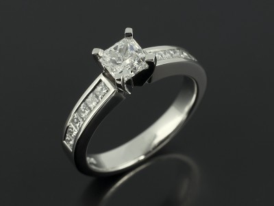 Ladies Diamond Engagement Ring, Platinum 4 Claw and Channel Set Design, Radiant Cut Diamond Centre Stone 0.70ct, D Colour, VS2 Clarity, Ex Polish, VG Symmetry, Princess Cut Diamonds x12 Channel Set Shoulder