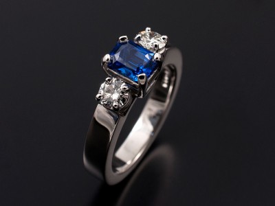 Radiant Cut 0.88ct Sapphire with 2 x 0.20ct F VS Round Brilliants in 18kt White Gold