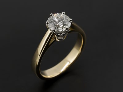 Round Brilliant 1.00ct F Colour SI2 Clarity EXEXVG in an 18kt Yellow and White Gold 6 Claw Solitaire Design.