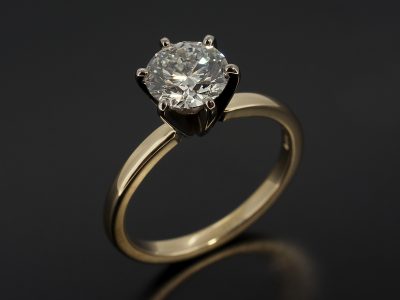 Round Brilliant 1.25ct F Colour SI1 Clarity EXEXEX in a 6 Claw 18kt White Gold and 14kt Yellow Gold Solitaire Design.