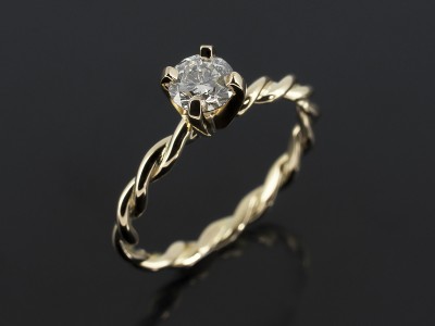 Round Brilliant 0.37ct H Colour SI1 Clarity in an 18kt Yellow Gold Twist Band Design.