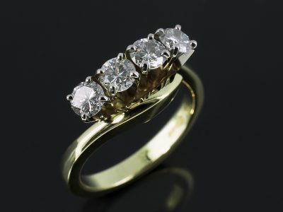 Round Brilliant Cut 4 Stone Twist Design 0.82ct Total F VS in 18kt Yellow and White Gold.