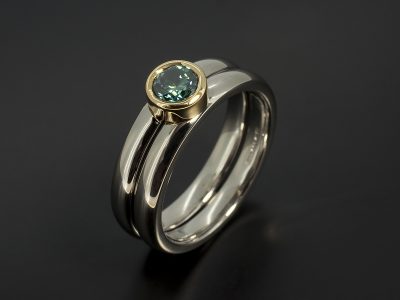 Round Brilliant Cut Blue Diamond 0.40ct in a Palladium and 18kt Yellow Gold Rub Over Set Design with Fitted Wedding Ring.