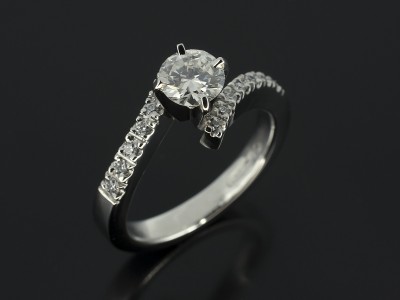 Round Brilliant 0.50ct F Colour SI1 Clarity in a Platinum 4 Claw Twist Design with Diamond Claw Set Shoulders.