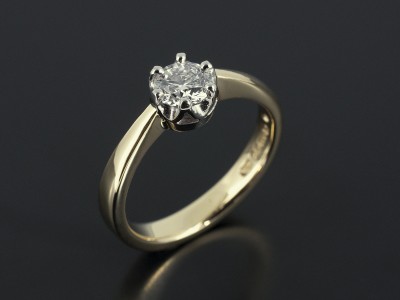 Round Brilliant 0.52ct E Colour SI1 Clarity in a 6 Claw Palladium Setting with 18kt Yellow Gold Band.