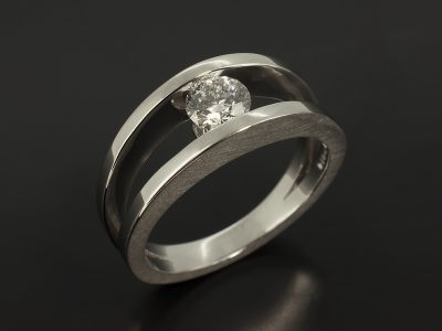 Round Brilliant 0.53ct E Colour SI2 Clarity EXEXEX in a Platinum Tension Set Design with Brushed and Polished Finish.