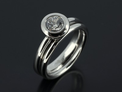 Round 0.57ct H Colour SI2 Clarity in a Platinum Rub Over Setting with Fitted Wedding Ring