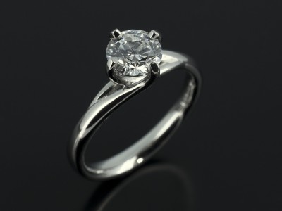 Round Brilliant 0.70ct E Colour SI1 Clarity in a Platinum 4 Claw Twist Compass Setting.