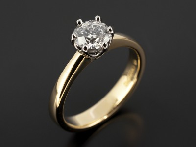 Round 0.74ct D Colour SI1 Clarity Triple Excellent Glade in a 6 Claw Platinum Setting with 18kt Yellow Gold Band.