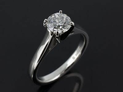 Round Brilliant 0.90ct D Colour SI1 Clarity in a Platinum 4 Claw Setting with Raised Gapped Shoulders.