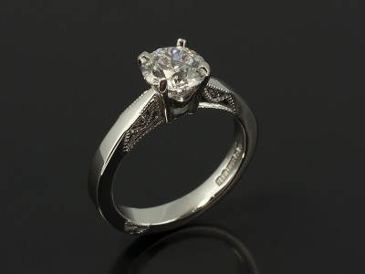 Round Brilliant Cut 0.90ct D Colour VS2 Clarity in a Platinum 4 Claw Design with Filigree Detail.