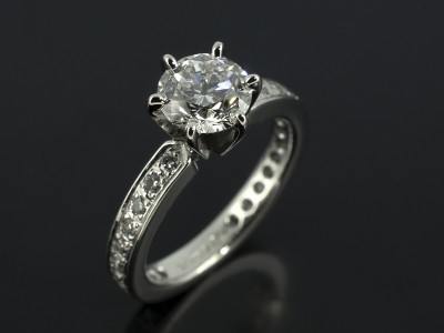 Round Brilliant 0.90ct E Colour SI2 Clarity in a Platinum 6 Claw Pavé Set Design.