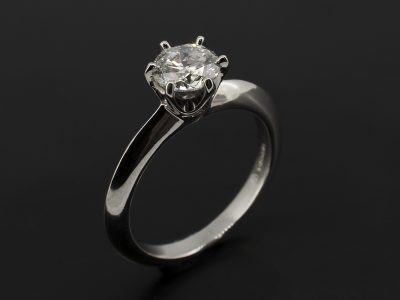 Round Brilliant 0.90ct F Colour SI1 Clarity EXEXEX in a Platinum 6 Claw Setting with Knife Edged Band.
