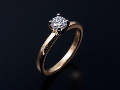 Round Brilliant 0.51ct F SI1 in a 4 Claw Platinum Setting with 18kt Yellow Gold Band.