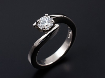 Round Brilliant 0.64ct D Colour SI1 Clarity EX Proportions, Polish and Symmetry Set in a 4 Claw Palladium Twist Setting.