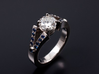 Round Brilliant 0.83ct with Round Sapphires Bead Set into Split Shoulders. Hand Made in Palladium