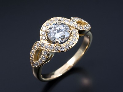 Round Brilliant 0.92ct E Colour VS2 Clarity in a 18kt Yellow Gold Pave Set Infinity Swirl Design.