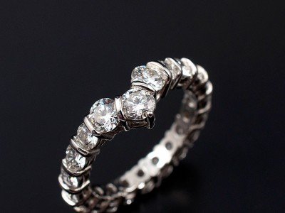 Round Brilliant 18 x 0.10ct F VS and 3 x 0.20ct F VS Diamonds Hand Made in a Platinum Bar Set Ring.