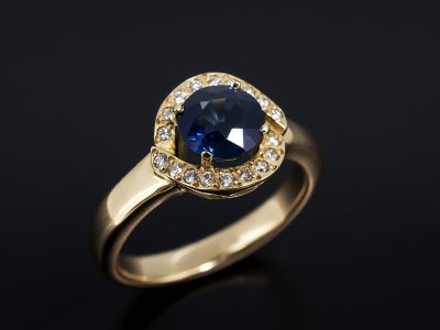 Ladies Sapphire and Diamond Halo Engagement Ring, 18kt Yellow Gold Claw and Pavé Set Design, Round Brilliant Cut Sapphire 1.61ct, Round Brilliant Cut Diamond Halo 0.09ct Total