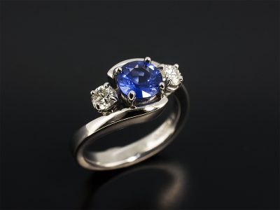 Round Brilliant Cut Sapphire 1.24ct with Round Brilliant Cut Diamonds 0.30ct (2) Set in Platinum in a Trilogy Twist Design