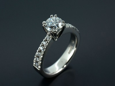 Round Brilliant E Colour SI2 Clarity in a Double Claw Setting with Claw Set Diamond Shoulders. Hand Made in Palladium.