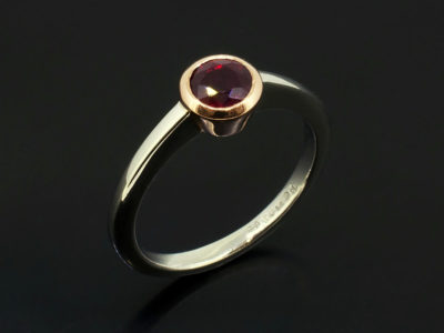 Pigeon Blood Round Ruby 0.81ct in a 9kt Rose Gold Rub Over Setting with Platinum Band Ladies Ring