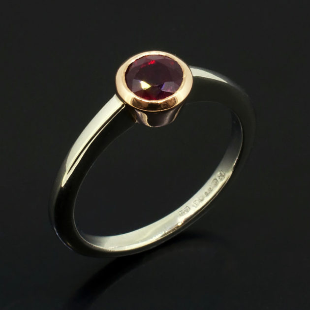 Pigeon Blood Round Ruby 0.81ct in a 9kt Rose Gold Rub Over Setting with Platinum Band Ladies Ring