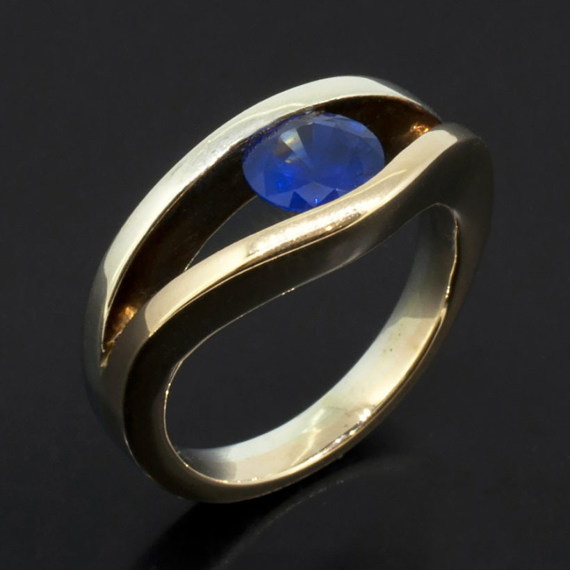 Round Brilliant Cut Sapphire 1.05ct in a Tension Set 9kt White and Yellow Gold Design Ladies Ring