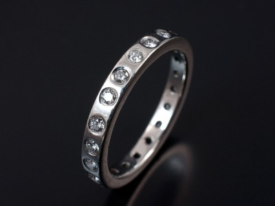 Round Brilliant Cut Secret Set Full Wedding Ring in Platinum