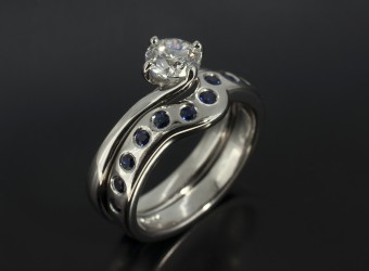 Round Sapphire Secret Set Fitted Platinum Wedding Ring.