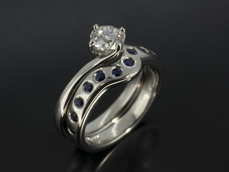 Round Sapphire Secret Set Fitted Platinum Wedding Ring.