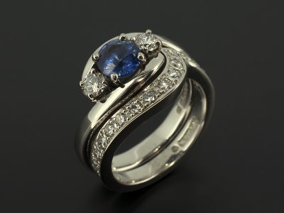 Round Sapphire 0.90ct with Round Brilliant Diamonds 0.30ct F VS with a Fitted Pavé Set Diamond Palladium Wedding Ring.