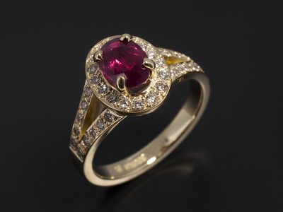 Oval Cut Ruby Oval 1.08ct in an18kt Yellow Gold Diamond Pavé Set Halo and Split Band Design.