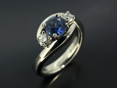 Palladium Trilogy Twist Design with Round Ceylonese Sapphire 0.90ct and Round Brilliant Cut Diamonds 0.30ct Total