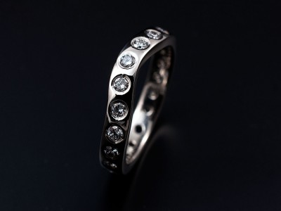 Secret set shaped hand made platinum eternity ring comprising 20 x 0.04ct FVS round brilliant diamonds