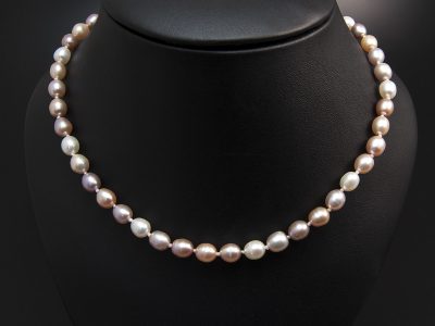 Multi Tone Seed Shape Freshwater Pearl Necklace 5x6mm With A Silver Oval Magnetic Clasp