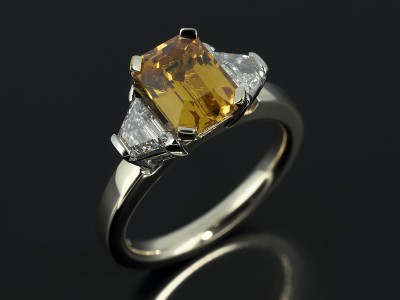 Emerald Cut Yellow Sapphire 1.80ct with 0.35ct Trapezium Cut Diamonds F VS in 9kt White and Yellow Gold Setting.