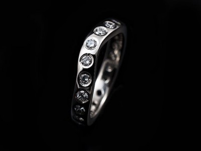 Secret set shaped hand made platinum eternity ring comprising 20 x 0.04ct FVS round brilliant diamonds