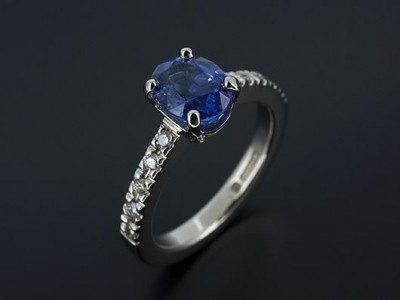 Oval Ceylonese Sapphire 2.13ct with Round Brilliant Diamonds Claw Set into Band. Hand Made in Palladium.