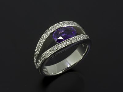 Oval Cut Purple Sapphire, 1.41ct Tension Set in Platinum With a Round Brilliant Cut Diamond 0.42ct (40) Pave Set Design